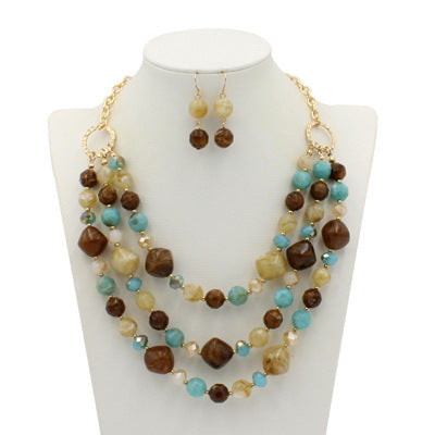 Comercio al por mayor de múltiples capas de plástico aretes collar conjunto de joyas